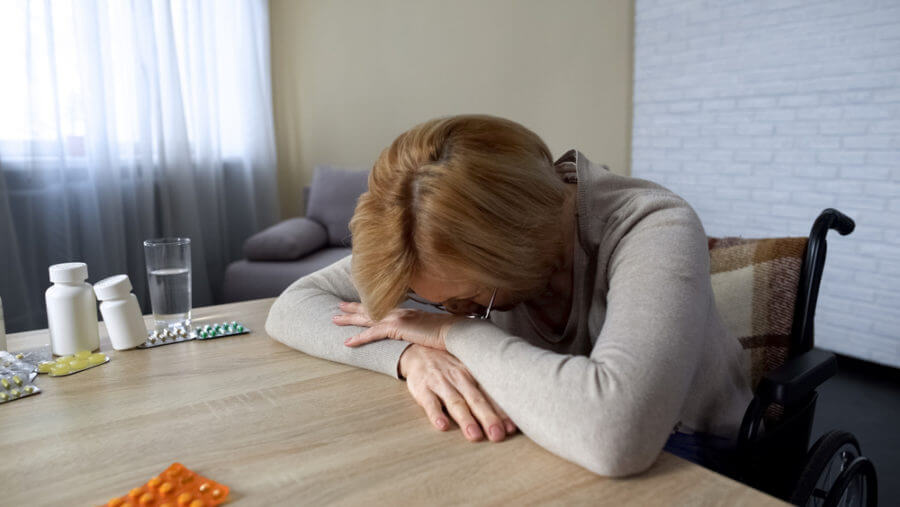 Lady with her head down on the table