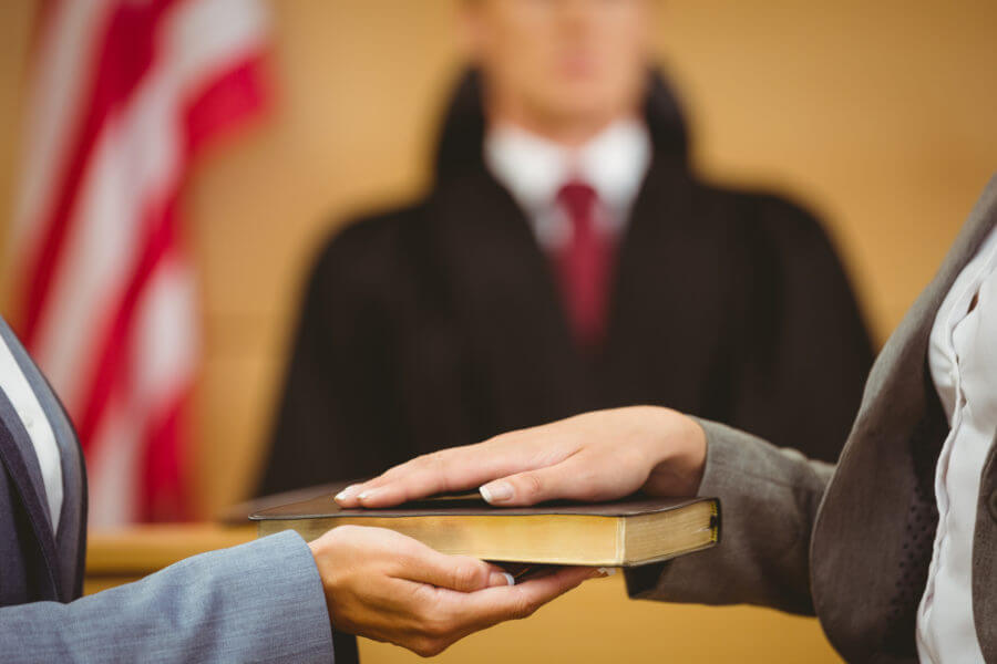 Witness being sworn-in in court