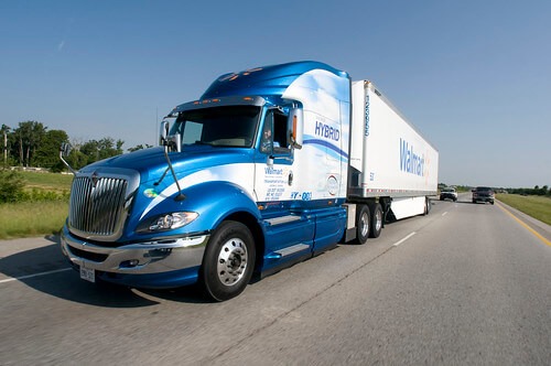 big rig 18 wheeler truck driving down the road