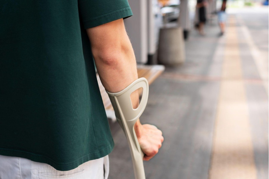 Injured person using crutch